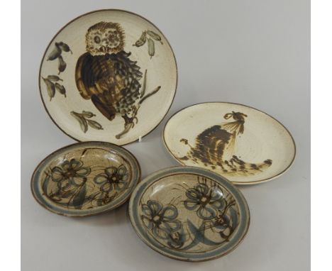 Two similar Studio Pottery stoneware plates, each decorated with birds, and two similar floral side plates, all in the manner