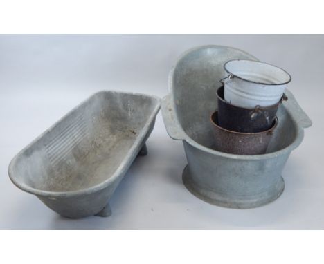 A collection of bygones, to include a zinc hip bath, a trough, and various buckets.