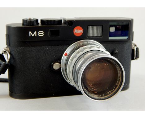 A Leica M8 camera, with Leitz Summicron F=5cm, 1:2 lens.