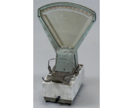 A set of Avery shop scales, in green and white enamel, lacking bowl.