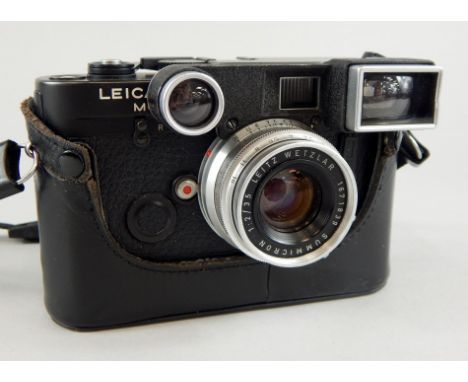 A Leica M6 camera, with Leitz Summicoron 1:2/35 lens.