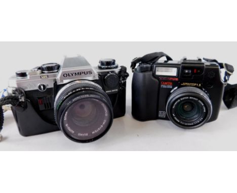 An Olympus OM10 camera, with lens, and an Olympus digital camera with Antler camera case.