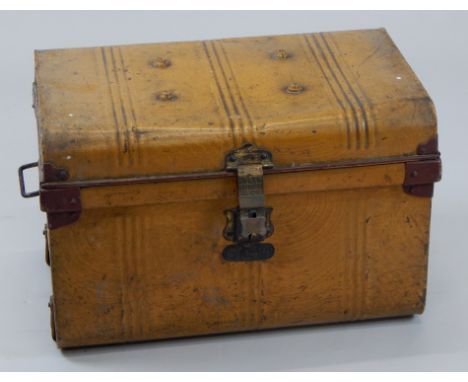 A mid-20thC tin trunk, with domed top, flanked by carrying handles, hinging to reveal a plain interior, 47cm high, 59cm wide,