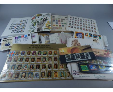 A collection of first day covers, Strand stamp album, loose stamps, empty albums, etc.