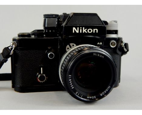 A Nikon camera with Nikkor 50mm lens.