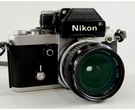 A Nikon camera with Nikkor 28mm lens.