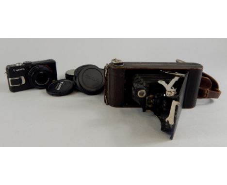 A Lumiz Panasonic digital camera and a Kodak F7.9 folding camera no. A120.