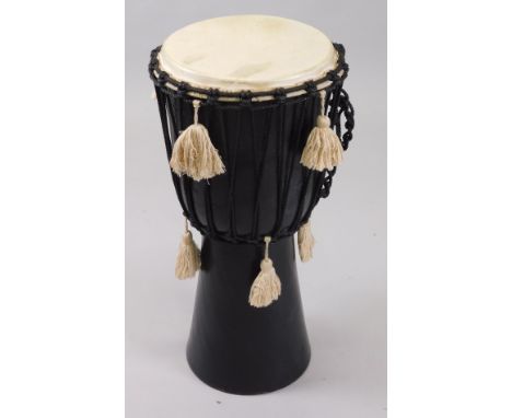 A ceramic and leather drum, in carrying case.