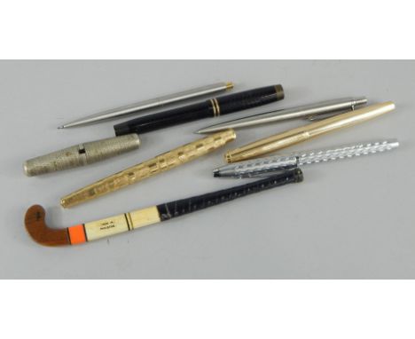 A quantity of fountain pens and Biros, to include Parker pens and a novelty miniature hockey stick. 