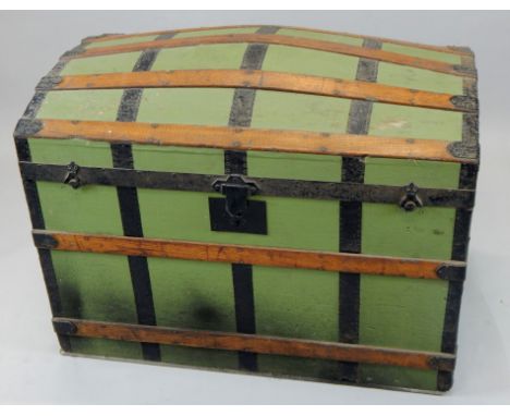 A late 19th/early 20thC leather dome top sea chest trunk, with metal and oak banding, heavy escutcheon and plain interior, 80