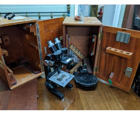 An Ernst Leitz, Westlar, Leica UK Ltd binocular scientific/jeweller's microscope serial number 563058 in wooden case, along w