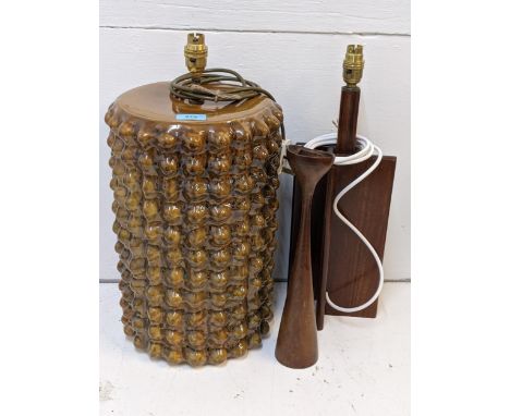 A brown glazed floral table top lamp, a 1960's teak lamp and a teak candlestick, rewired and PAT testedLocation:If there is n