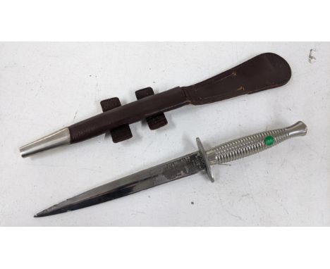 A commemorative Wilkinson Sword Fairbairn Sykes pattern commando dagger, etched makers mark to the blade and notation for Que