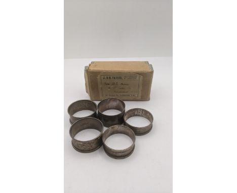 Five silver napkin rings, each with engine turned decoration, total weight 66.9g Location:If there is no condition report sho