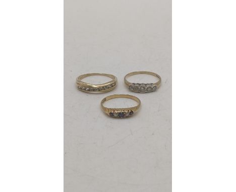 Three ladies yellow gold rings to include an 18ct yellow gold diamond and blue sapphire ring 1.9g together with a yellow and 
