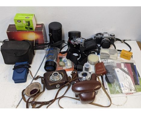 Photographic equipment to include an Olympus OS20 with a Sigma mini wide II and a 70-210mm lenses, a kodak and others with ac