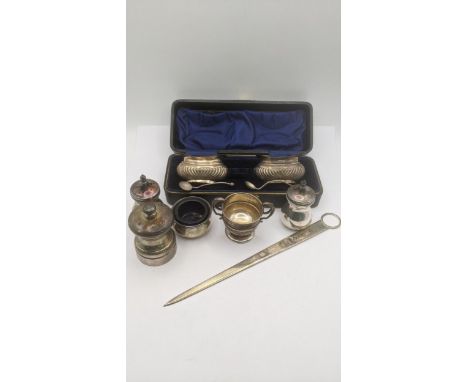 Silver to include  pair of salts in a fitted case, a pepper grinder, a meat stick and others, total weight excluding pepper g