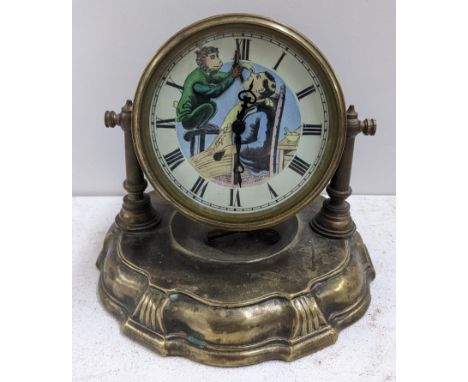 An early/mid 20th century brass drum cased mantel clock with automaton monkey barber dial, 16cm h x 19cm wLocation: 9.1If the