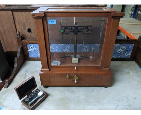 An American wooden cased analytical chemist scales by Henry Troemner for Arthur H Thomas Co Philadelphia with sliding door wi