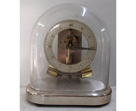 A mid 20th century Junghans Anticlimatic Electronic clock under a glass dome, 23.5cm h x 22.5cm wLocation: 9.1If there is no 