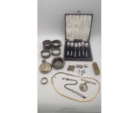 A mixed lot to include a group of 5 silver napkin rings 73.2g, silver plated tea spoons, a keyless open face pocket watch, al