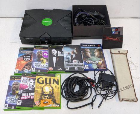 An Xbox One, with a controller, converter and a selection of games to include Need for Speed Underground, The Godfather, Gun,