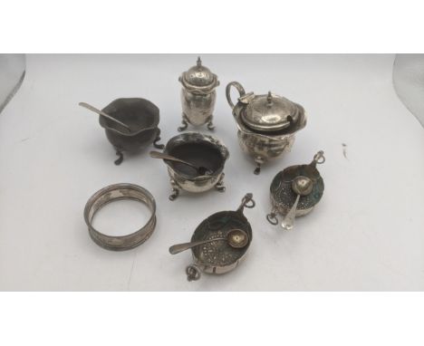 A selection of silver and white metal condiment pots and spoons to include a mustard pot having a blue glass liner A/F, along