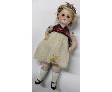 A circa 1900 German miniature bisque doll, possibly Simon & Halbig, 9cm, contained in a Cadbury chocolate boxLocation: cabIf 