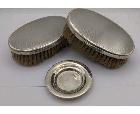 Asprey of London silver to include two dressing table brushes along with a pin dish hallmarked Birmingham 1912LocationIf ther