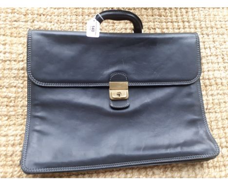 The Bridge- A large black folio style briefcase with brushed brass hardware. Location: R1.1If there is no condition report, p