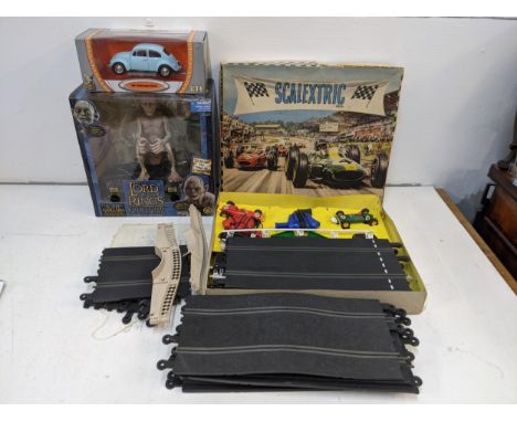 A boxed Scalextric set 30 track with cars (completeness not guaranteed) a boxed electronic talking Gollum and a boxed model o