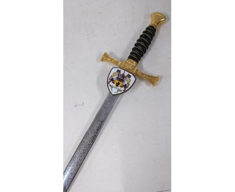 A Wilkinson modern sword, having a leather grip with wire banding, gilt cross guard and with an enamel Wilkinson coat of arms