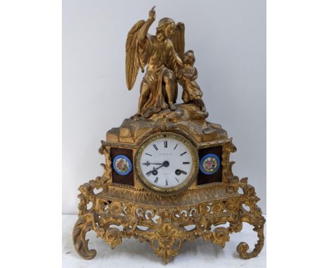 A late 19th century French gilt metal 8-day mantel clock the top fashioned as an angel with a child, the dial signed Jaquier,