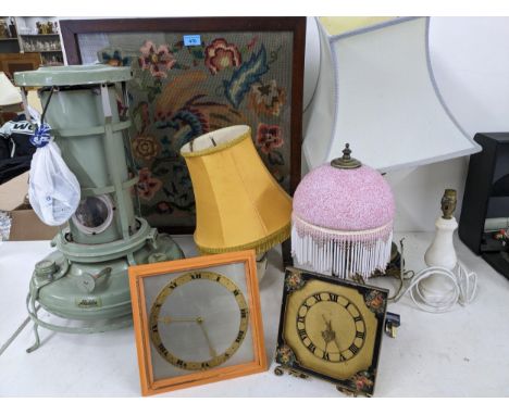 A mixed lot to include four table lamps (three with shades), two strut clocks, Aladdin paraffin heater and a tapestry oak fir