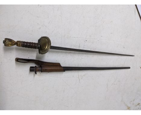 A Victorian court sword with pointed quartered blade, leather grip to handle, gilt metal pommel, iron scabbard with leather m