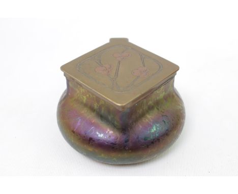 A Kralik opalescent glass inkwell, in the manner of Loetz, hinged brass cover embossed with holly leaves, Czechoslovakia, c.1