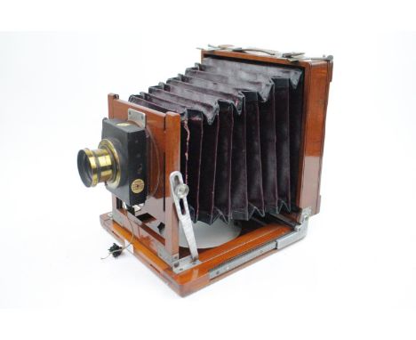 A Victorian Thornton Pickard mahogany triple-plate camera with plates and tripod &amp; Ross of London Zeiss Anastigmat 1:8 WA