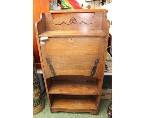 Arts &amp; Crafts Oak fall front students bureau with stylised hinges over shelf base 
