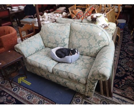 A WESLEY-BARRELL TWO SEATER SOFA OF TRADITIONAL FORM upholstered in 'Venice Jade' Damask with scrolling arms, 168cms wide and