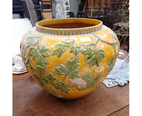 A LARGE LINTHORPE POTTERY JARDINIERE, relief moulded with peonies on a yellow ground, 39cms high (examine)