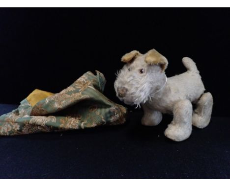 A VINTAGE TOY PLUSH DOG ON WHEELS, believed to be by Steiff