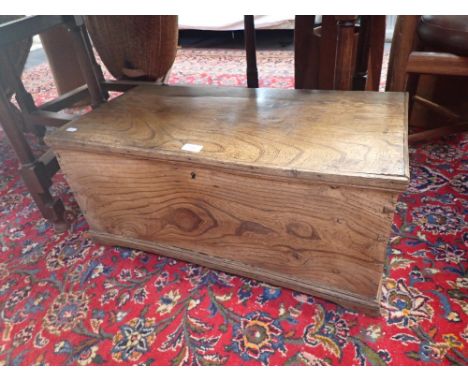 A 19TH CENTURY ELM TRUNK of small proportions, 75cms wide
