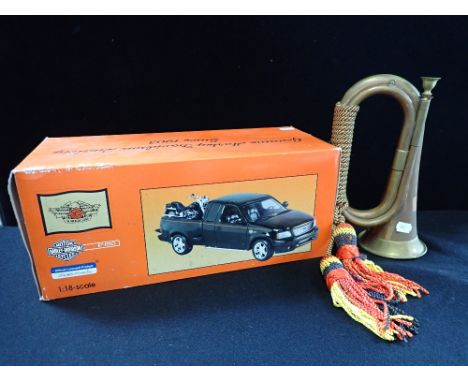 A HARLEY DAVIDSON MOTORCYLCE CO. MODEL FORD PICKUP TRUCK with motorcycle 1:18 scale (boxed) and a copper bugle