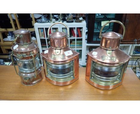 A PAIR OF PORT AND STARBOARD COPPER LAMPS, 29cms high and a similar 'Anchor' lamp