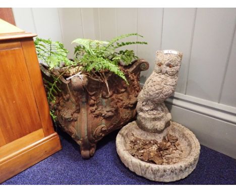 A VICTORIAN STYLE CAST IRON GARDEN PLANTER and a reconstituted stone owl birdbath (2)