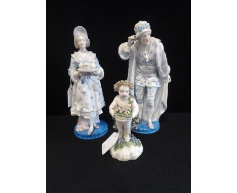 A 19TH CENTURY CERAMIC FIGURE OF A CHILD holding a floral basket, 14cm high and a pair of Victorian figures (3)