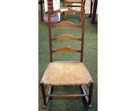 An early oak rush-seated ladder-back rocking chair