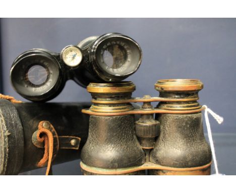 PAIR OF COMPASS BINOCULARSThe compass mounted between the eyepieces, ebonised finish, 17cm long, in fitted case; together wit