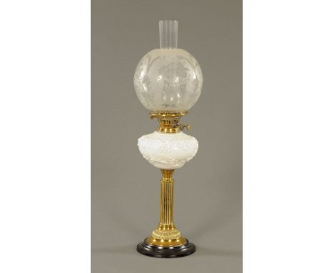 A Victorian brass table oil lamp, with moulded white glass reservoir, fluted column and cast iron base, with repaired etched 