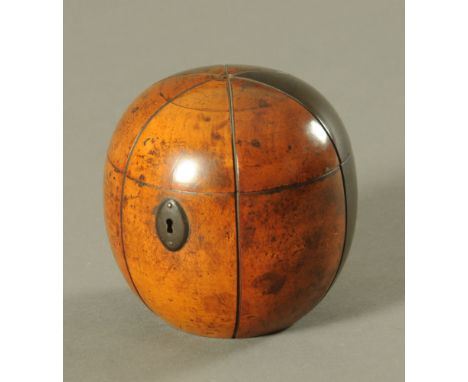 A Georgian fruitwood "Melon" tea caddy, with oval lock escutcheon and traces of original lead lining.  Height 12 cm, diameter